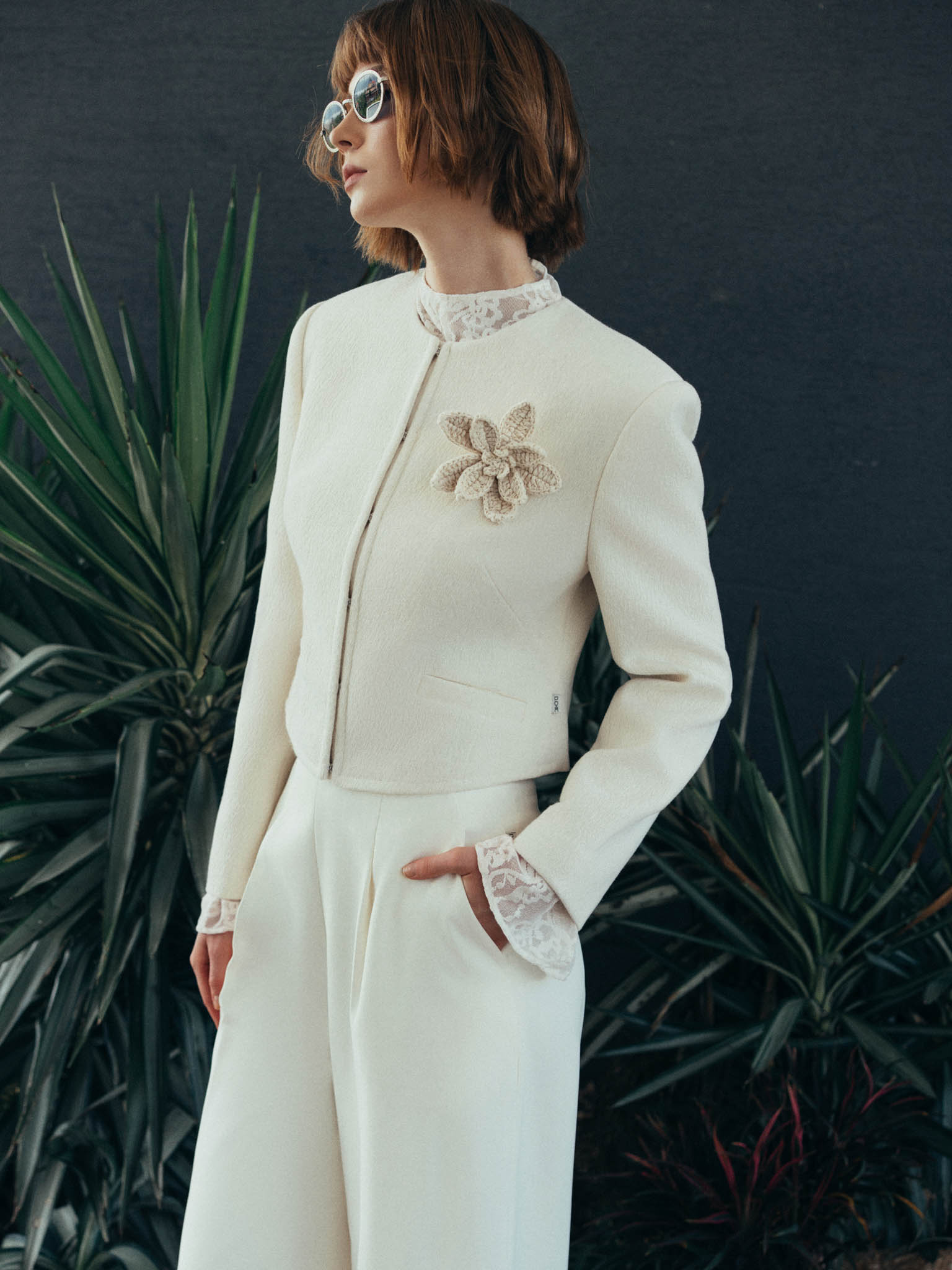 Short Round-Neck Wool Jacket with Contrast Topstitched Trim, Welt Pockets and Corsage